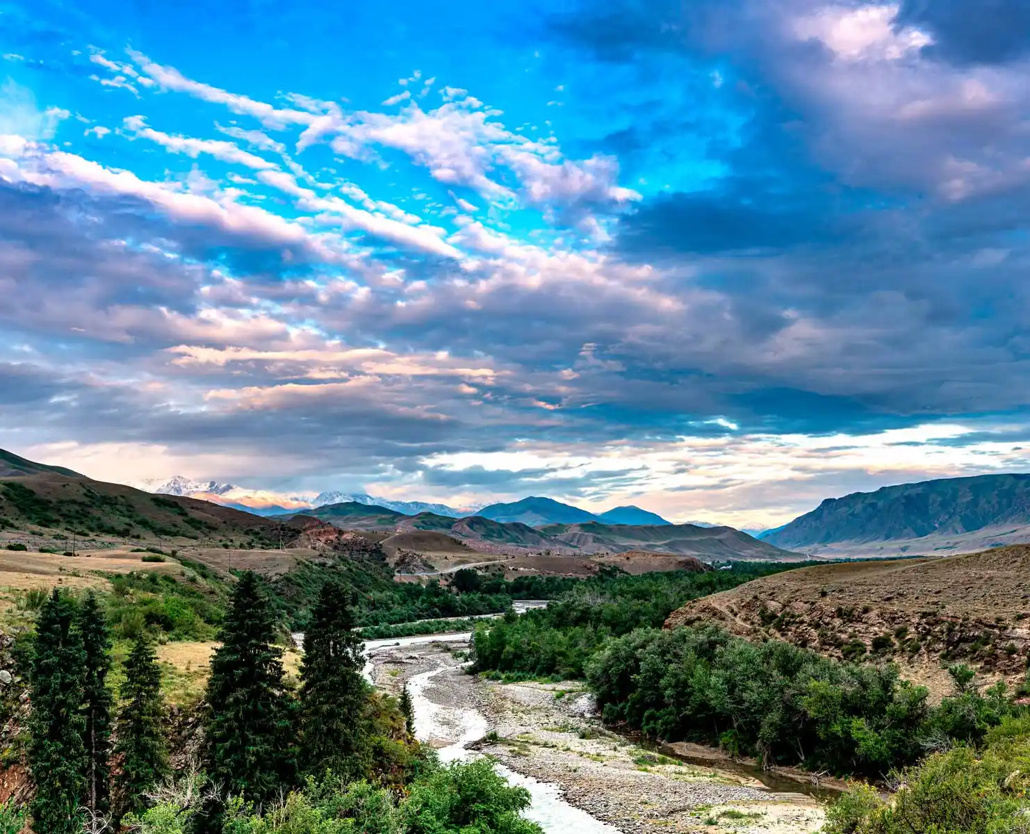 Mountain landscape with river and dramatic clouds, Kazakhstan travel destination